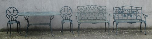 Lot 427 - A metal green painted table with two benches...