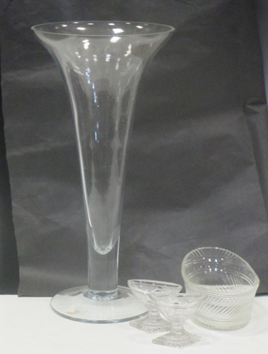 Lot 66 - A tall fluted glass vase, 50cm high together...