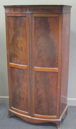 Lot 339 - A mahogany two-door bow front wardrobe, 192 x...