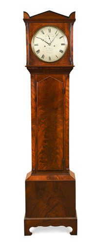 Lot 543 - A Regency figured mahogany longcase clock