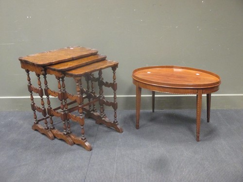 Lot 350 - An oval mahogany coffee table with raised edge,...