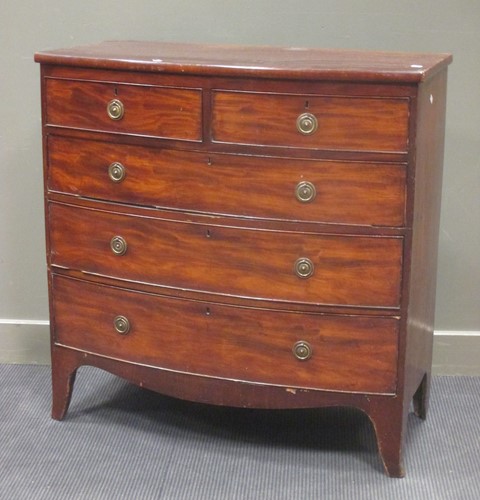 Lot 393 - A George III figured mahogany bow fronted...