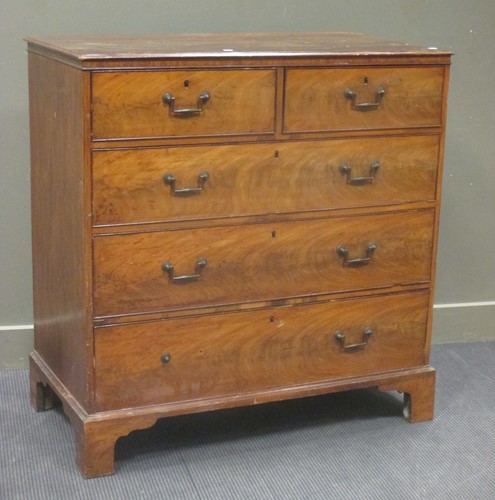 Lot 394 - A George III figured mahogany chest of two...