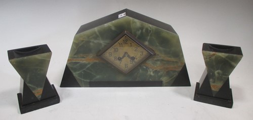 Lot 130A - An Art Deco onyx clock garniture