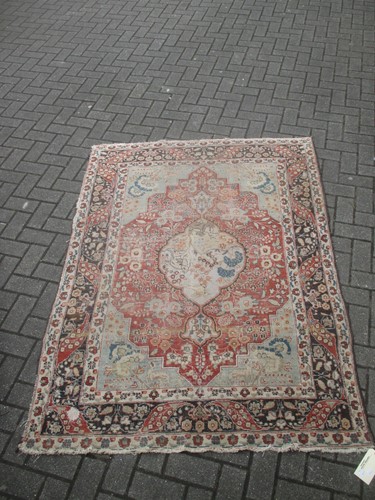 Lot 495 - Red ground Persian syle rug, worn in places...