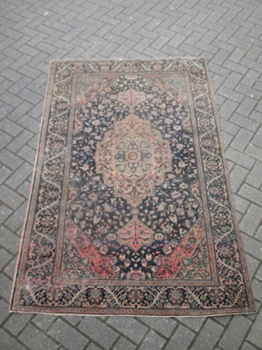 Lot 497 - A Perisan design rug with blue ground and...