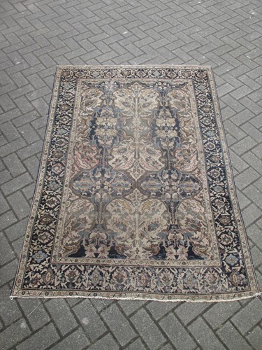 Lot 496 - A Perisan design rug with blue ground and...
