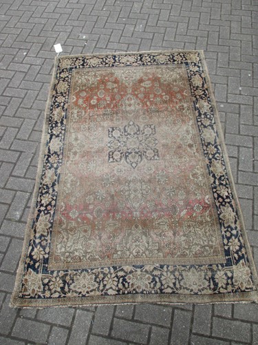 Lot 491 - A Perisan design floral rug with pale red...