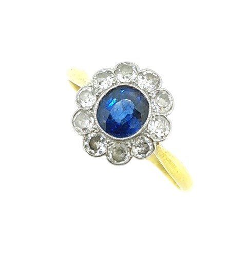 Lot 185 - A sapphire and diamond cluster ring