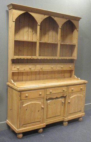 Lot 387 - A pine kitchen dresser, the top section with...