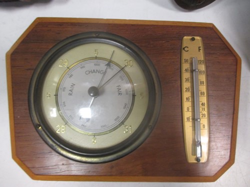 Lot 57 - An aneroid barometer, another barometer, a...