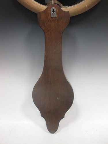 Lot 57 - An aneroid barometer, another barometer, a...