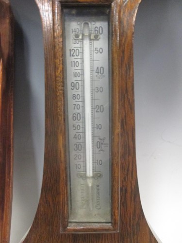 Lot 57 - An aneroid barometer, another barometer, a...
