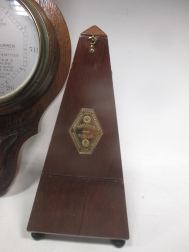 Lot 57 - An aneroid barometer, another barometer, a...