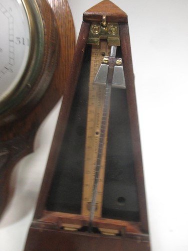 Lot 57 - An aneroid barometer, another barometer, a...