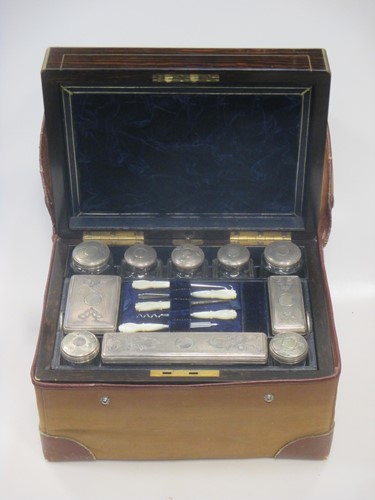 Lot 194 - A rosewood and brass inlaid lady's travelling...