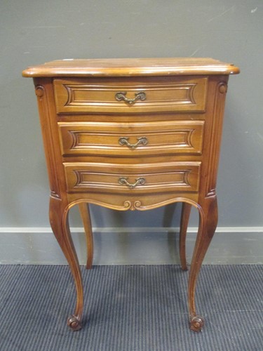 Lot 341 - A French bedside cabinet, the serpentine front...
