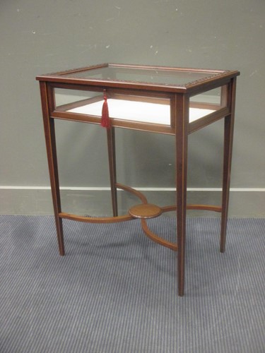 Lot 388 - Circa 1900 a mahogany bijouterie table, the...
