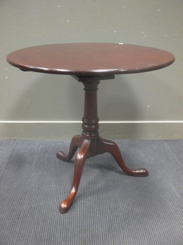Lot 391 - A George III mahogany birdcage circular tilt...
