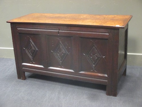 Lot 330 - An early 18th century oak three panel coffer...