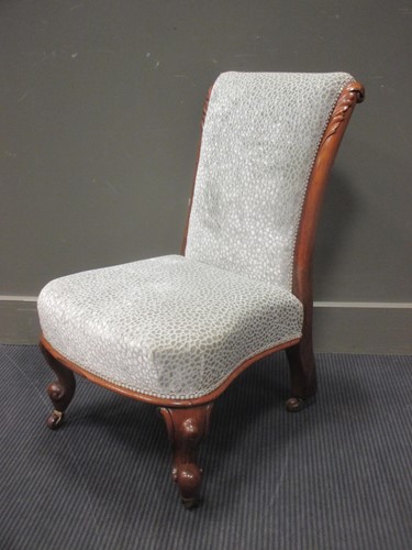 Lot 359 - A mid Victorian carved walnut low chair on...