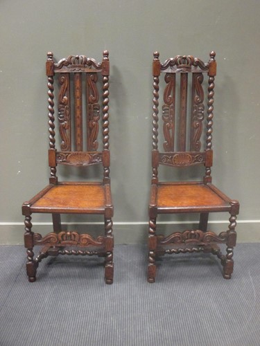 Lot 353 - A pair of oak coronet carved hall chairs (2)