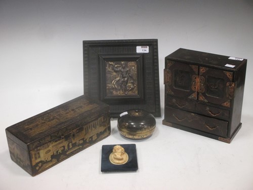 Lot 134 - A repousse copper alloy and gilt panel in...