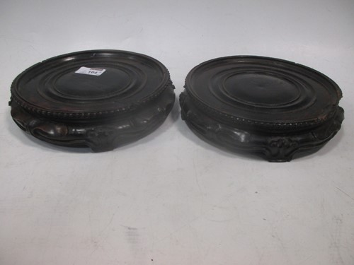 Lot 164a - A pair of Chinese circular wood stands (2)