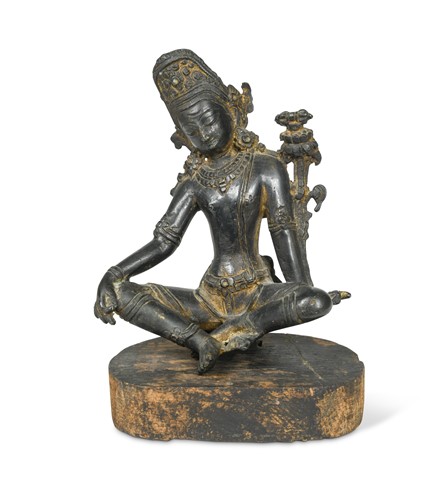 Lot 383 - A Nepalese bronze Tara on wood stand