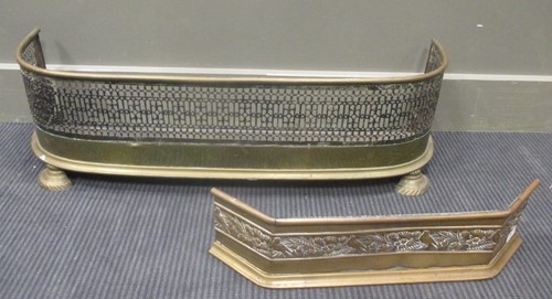 Lot 455 - A pierced brass fender, 86 x 20cm together...