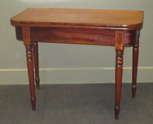 Lot 462 - A 19th century mahogany tea table on turned...
