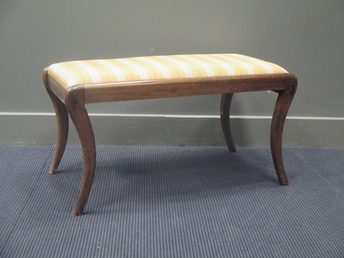 Lot 461 - A 19th century mahogany footstool on four...