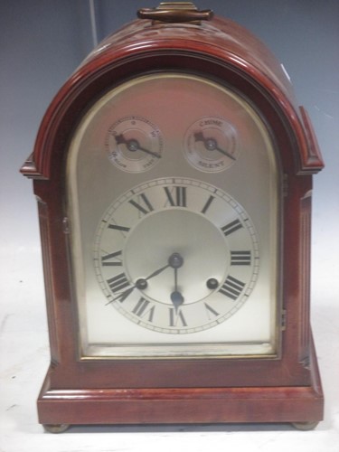 Lot 356 - A dome top mahogany chiming table clock with...