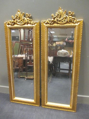 Lot 479 - A pair of italian style giltwood pier mirrors...