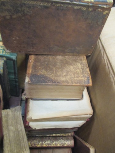 Lot 472 - Box of assorted books, many in worn condition,...