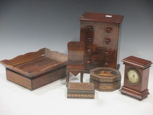 Lot 25 - A miniature walnut faux chest of drawers (now...