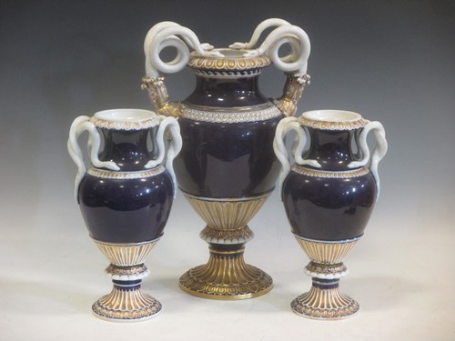Lot 90 - A garniture of three blue, white and gilt...