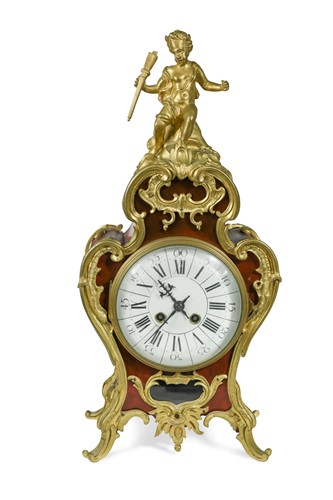 Lot 531 - A Louis XV style simulated tortoiseshell and gilt metal mounted mantel clock