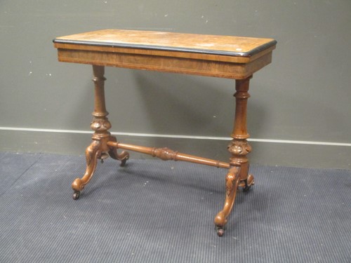 Lot 565 - A Victorian walnut rectangular card table, on...