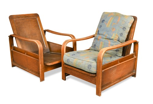 Lot 135 - Attributed to Heal's, a pair of oak reclining armchairs, circa 1935