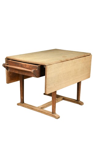 Lot 117 - A Cotswold School oak drop-leaf dining table, circa 1910