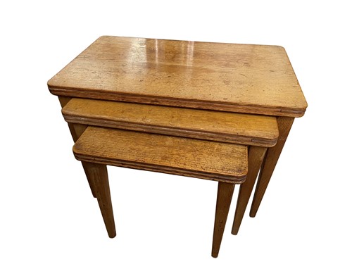 Lot 130 - Gordon Russell, a nest of three oak tables