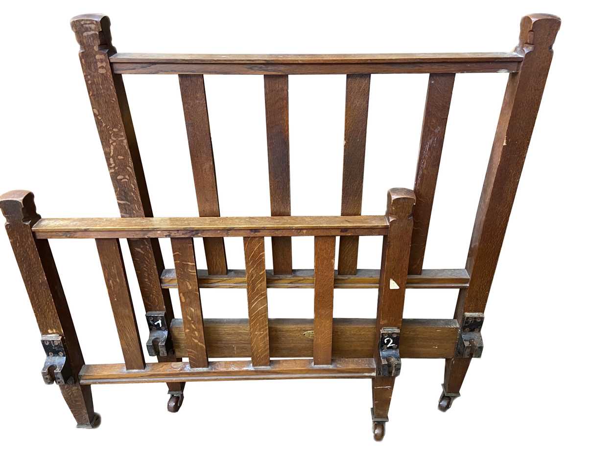 Lot 485 - A Heal's oak single bed frame, circa 1900