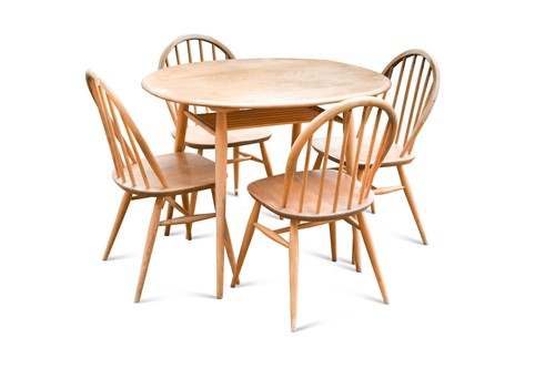 Lot 183 - An Ercol elm dining and four chairs