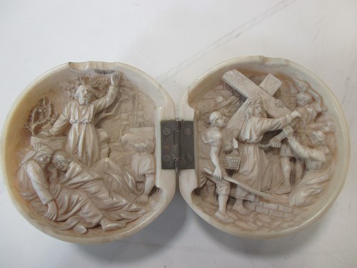 Lot 140 - A late 19th century carved ivory hinged ball,...