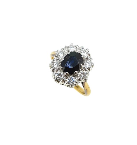 Lot 112 - A sapphire and diamond cluster ring