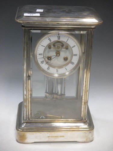 Lot 19 - A four glass mantel clock within a silvered...