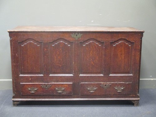 Lot 331 - An 18th century oak mule chest, with a two...