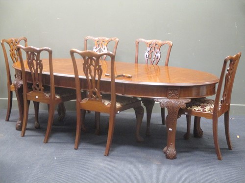 Lot 334 - A 20th century mahogany oval extending dining...