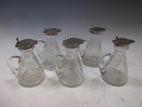 Lot 184 - A set of 5 George V silver topped glass...